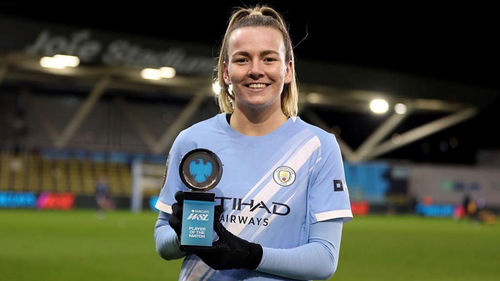 Lauren Hemp with her Player of the Match trophy