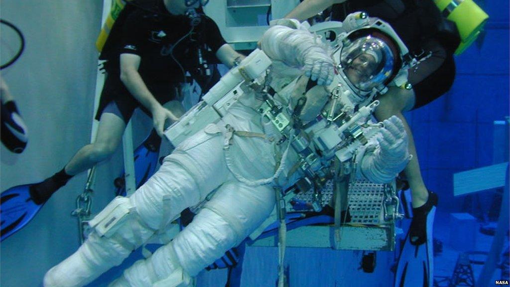 Astronaut trains in a pool