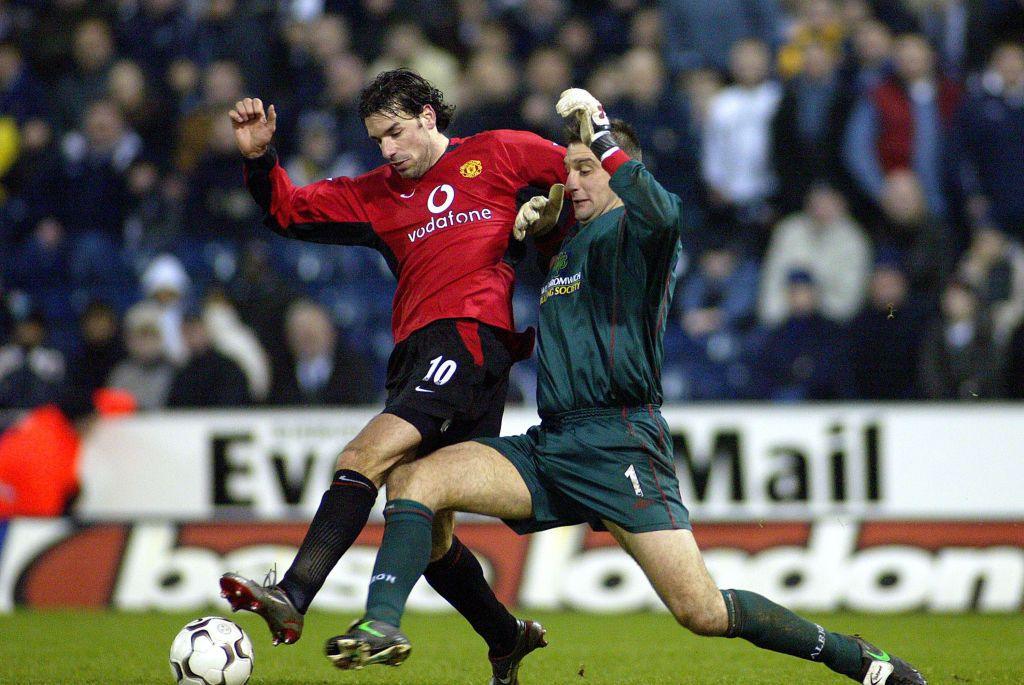 Russell tackling Manchester United player Ruud van Nistelrooy