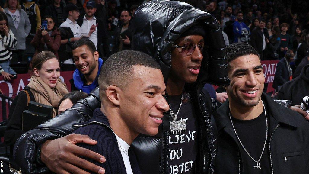PSG stars Kylian Mbappe and Achraf Hakimi at a recent game between the Brooklyn Nets and the San Antonio Spurs