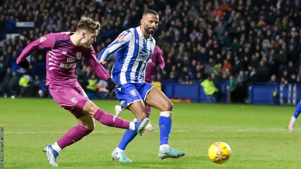 Cian Ashford shoots at goal