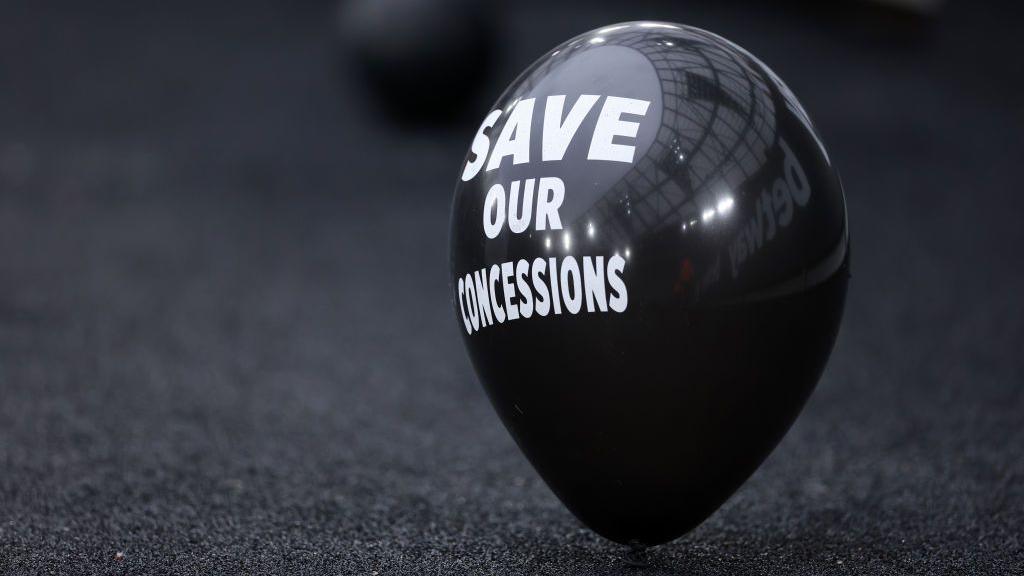 A black balloon bearing the slogan 'save our concessions' sits outside the London Stadium ahead of West ham United's Premier League match against Manchester City