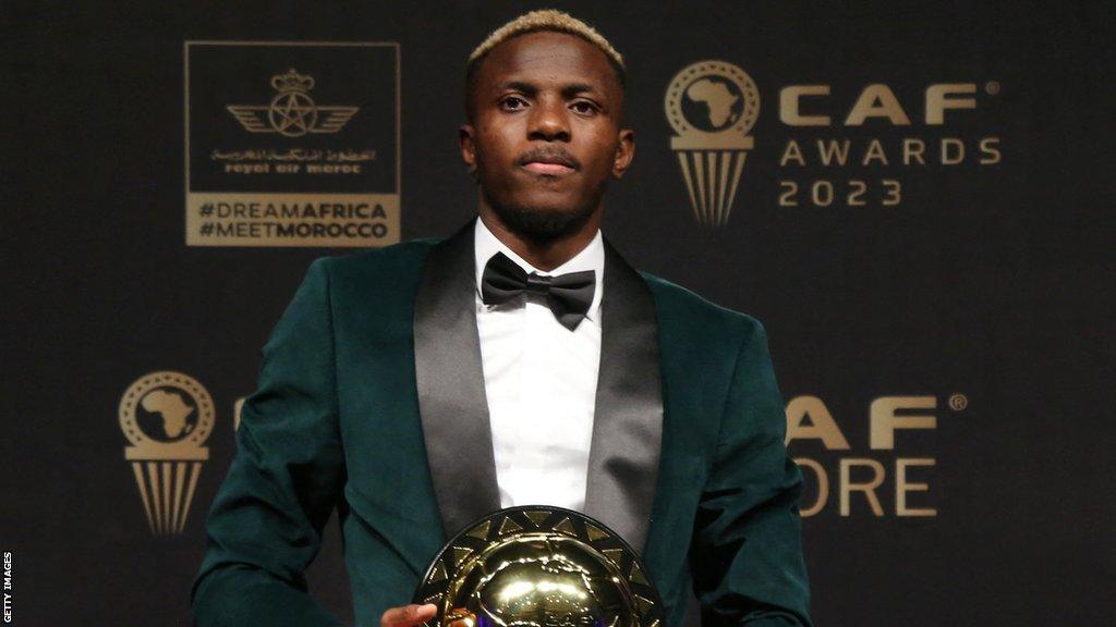 Victor Osimhen with the Confederation of African Football's Footballer of the Year award