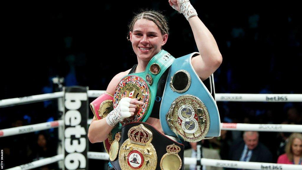 Savannah Marshall celebrates with her belts