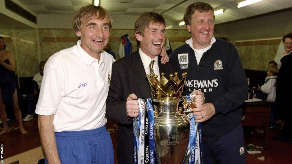 Blackburn Rovers manager Kenny Dalglish (centre) posing with the Premier League trophy