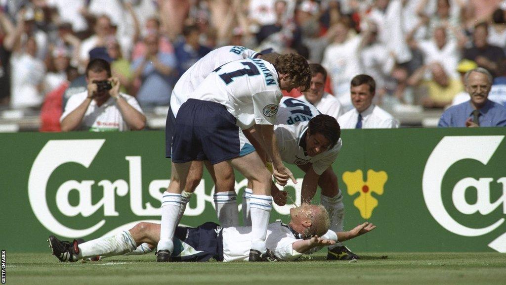 Paul Gascoigne celebrates with team-mates after scoring for England against Scotland at Euro 96