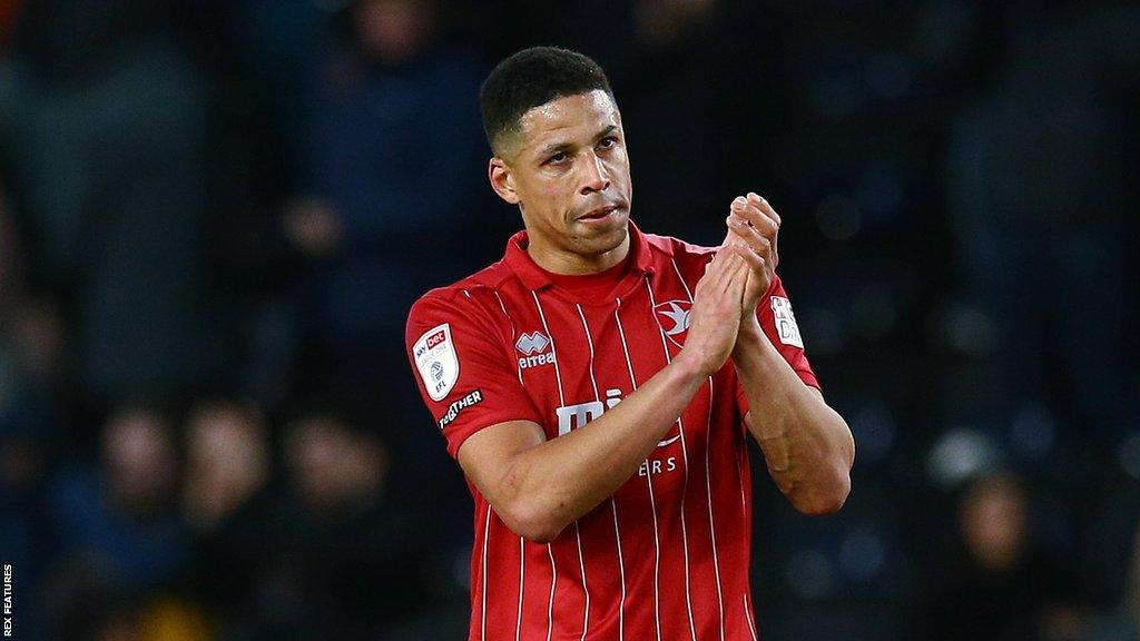 Curtis Davies claps his hands at the end of a game