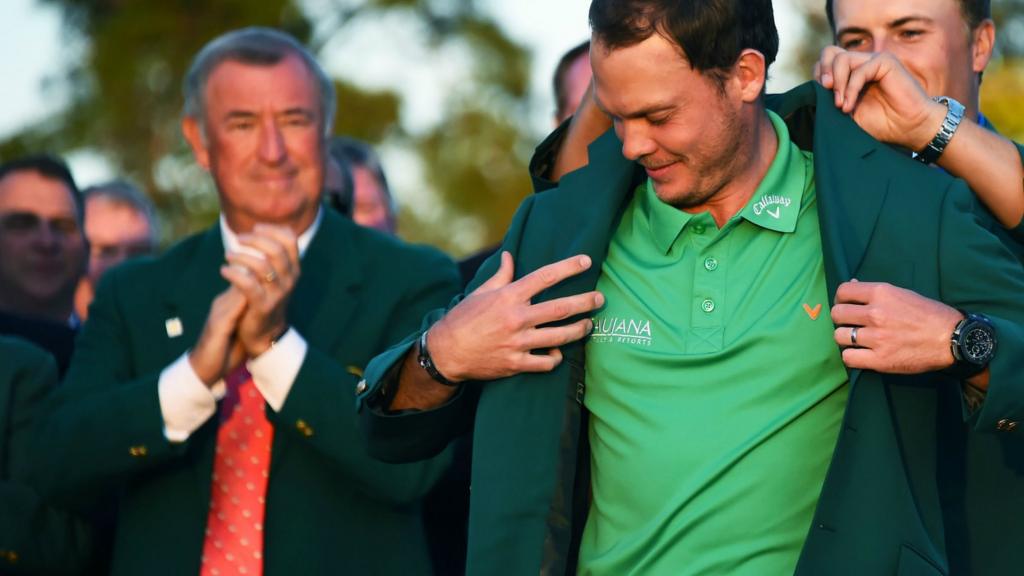 Jordan Spieth hands Danny Willett the green jacket