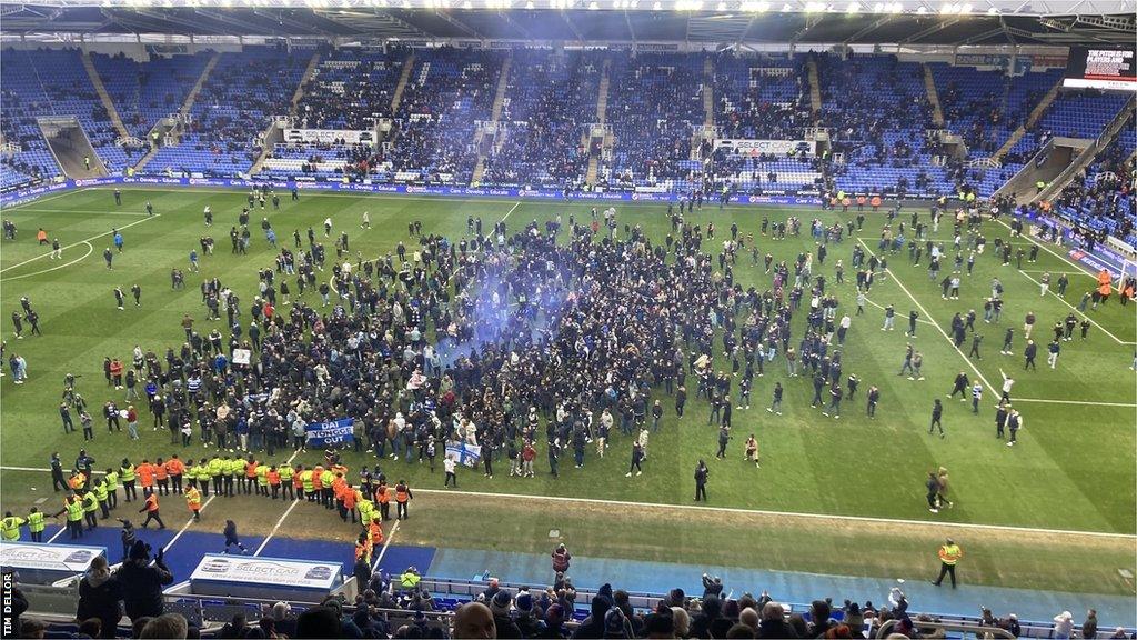 Reading fans invade the pitch