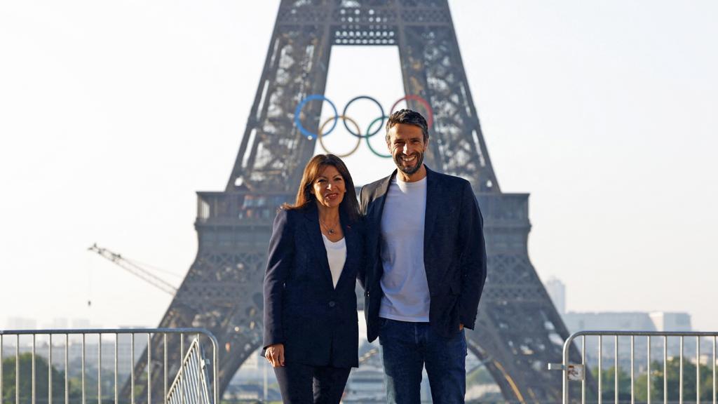 Hidalgo in front of olympics logo on Eiffel Tower in Paris on 7 June