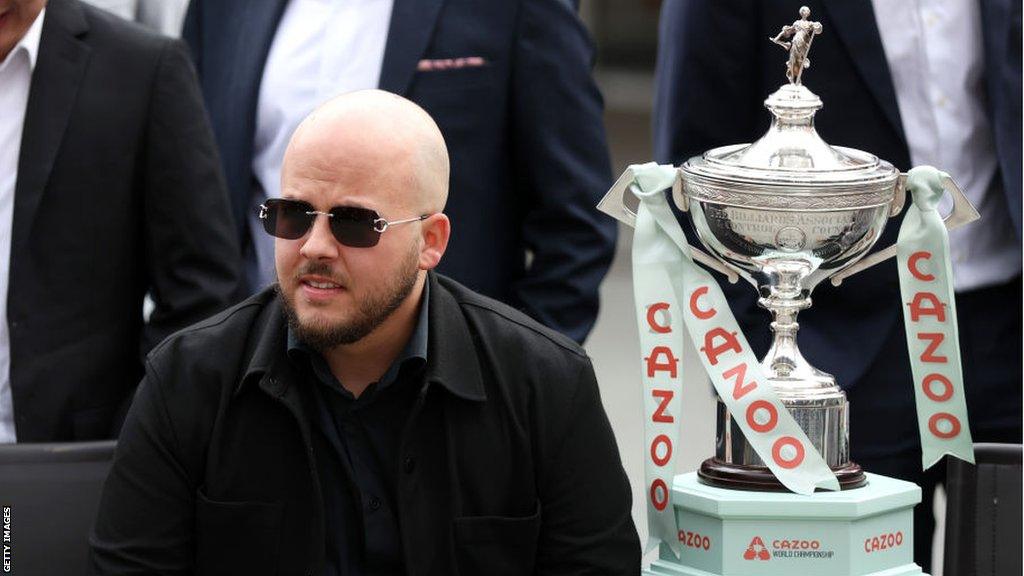 Luca Brecel with the World Championship trophy