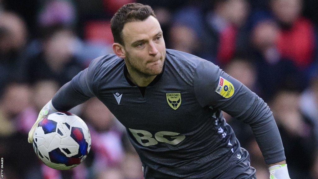 Oxford United goalkeeper Simon Eastwood prepares to throw the ball to a team-mate