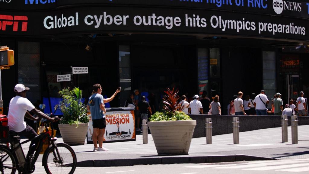 Global Cyber Outage information displayed on a Screen in Times Square New York, New York, USA, 19 July 2024