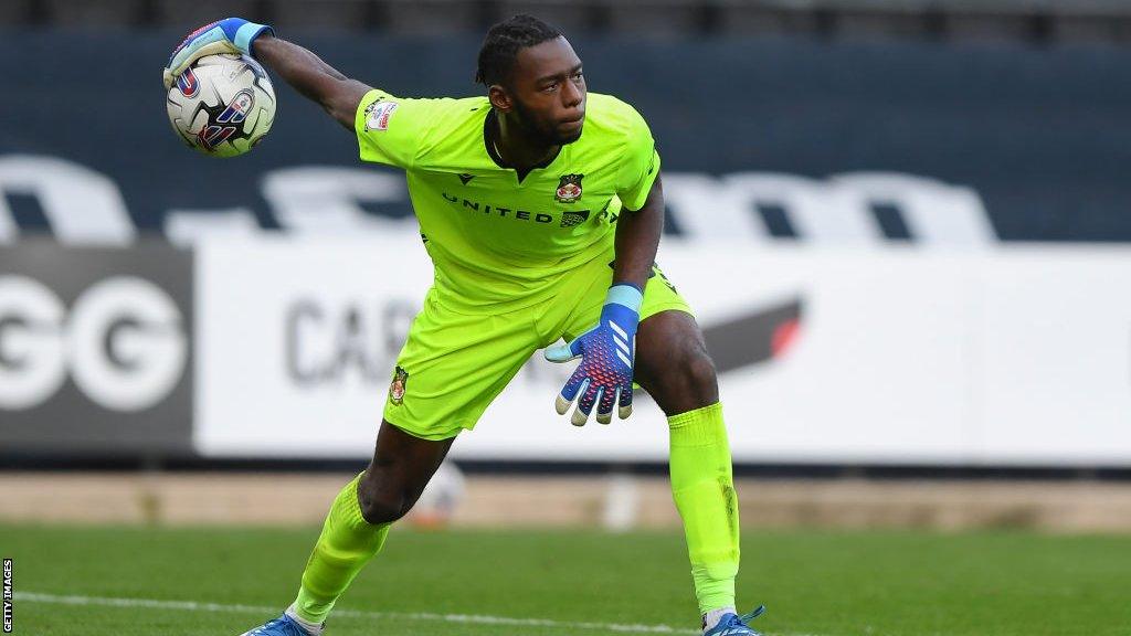 Arthur Okonkwo prepares to release the ball