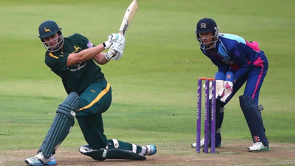 Nottinghamshire's Alex Hales bats while Middlesex's John Simpson looks on