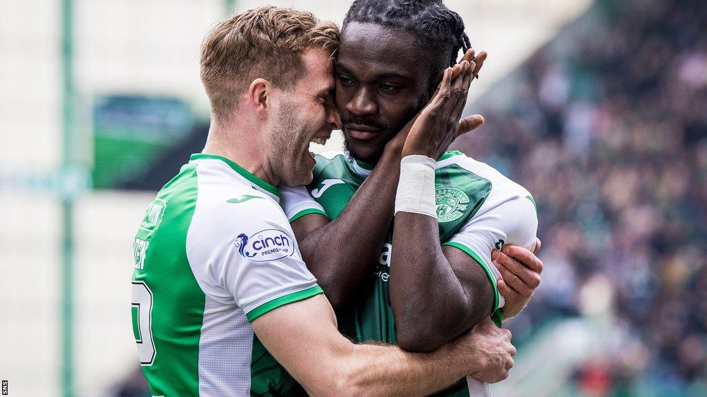 Hibernian's Chris Cadden congratulates Elie Youan