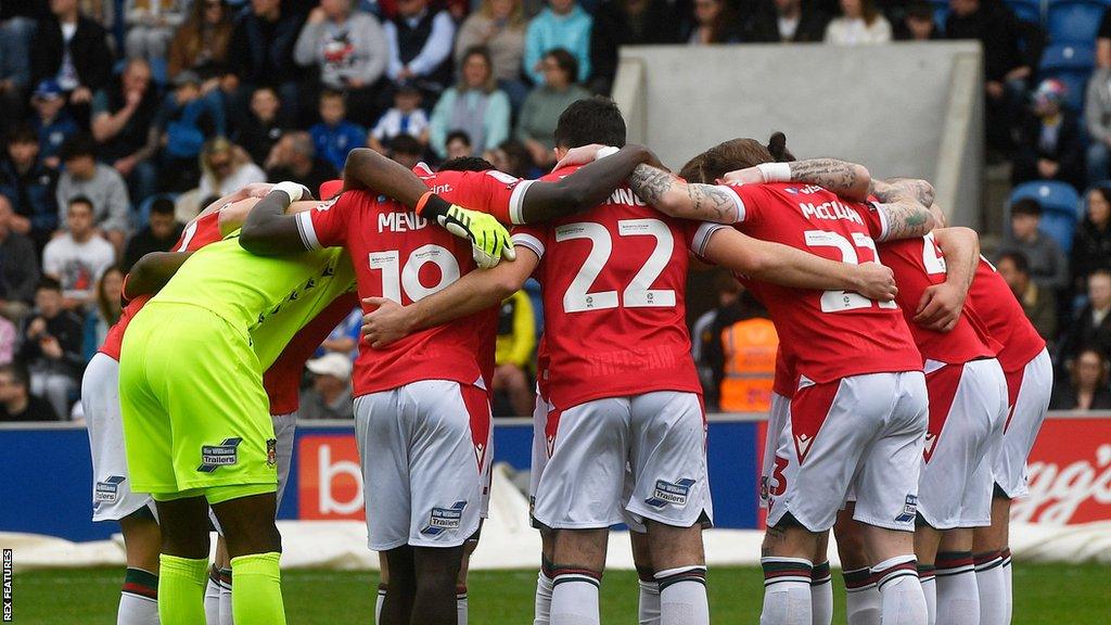 Wrexham players in huddle