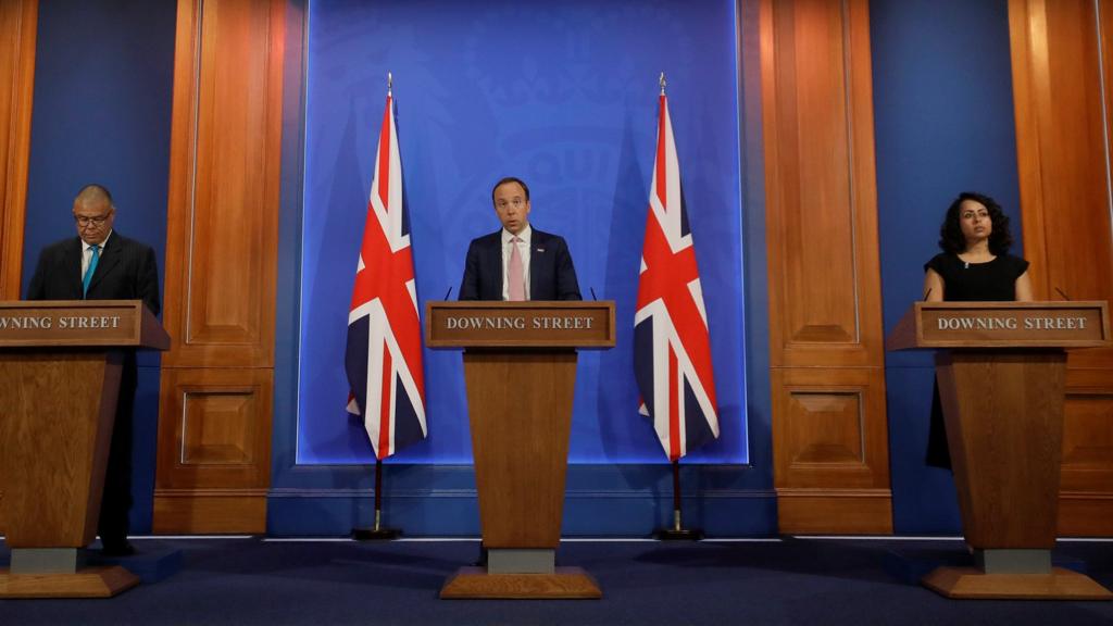 Health Secretary Matt Hancock speaks as Deputy Chief Medical Officer for England Jonathan Van-Tam and Doctor Nikki Kanani of NHS England listen during a virtual news conference at 9 Downing Street in London, Britain, April 28, 2021.