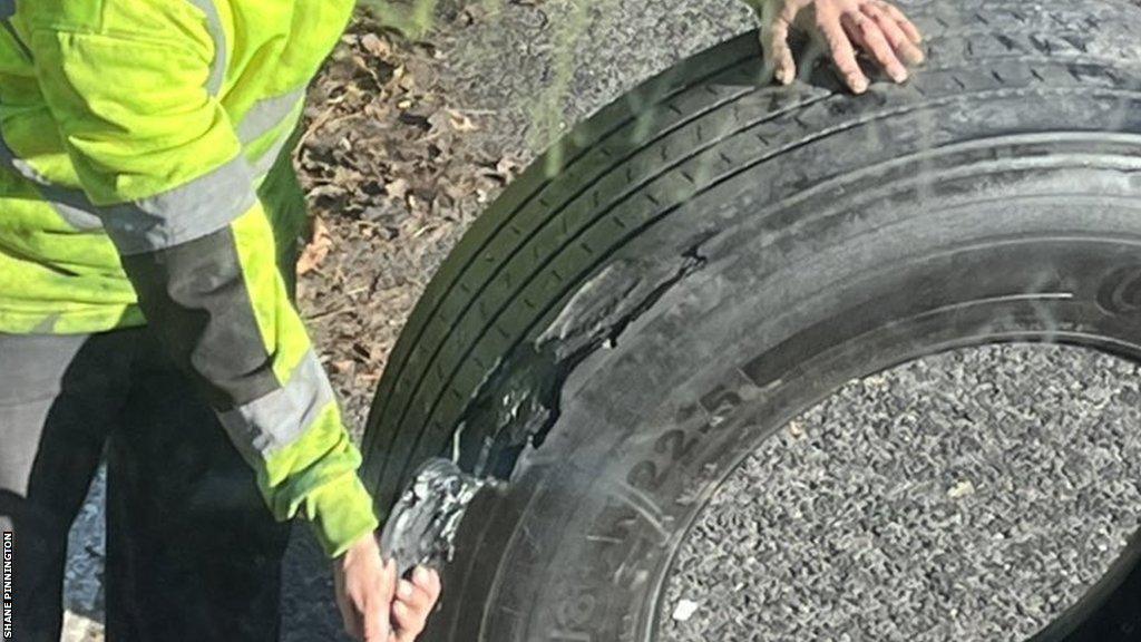 The Chester team bus' blown-out tyre