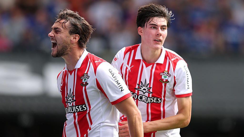 Taylor Harwood-Bellis (left) and Jay Robinson (right) celebrate after scoring an equaliser