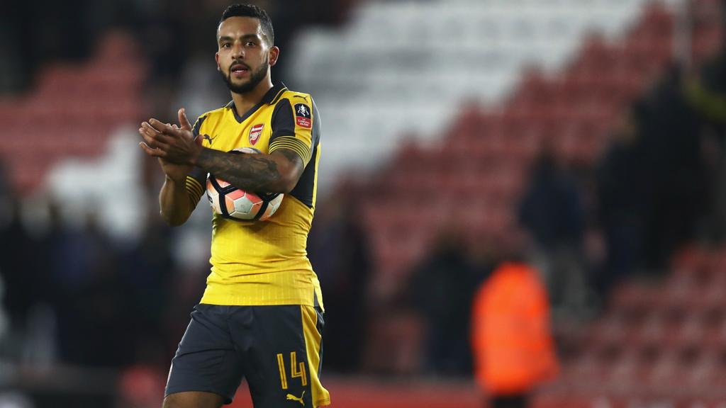 Arsenal's Theo Walcott with the matchball