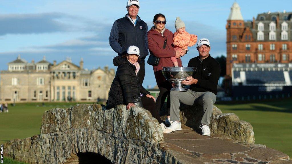 Ryan Fox (right, with trophy) with his daughter, wife and mother and father on the Swilcan Bridge at St Andrews