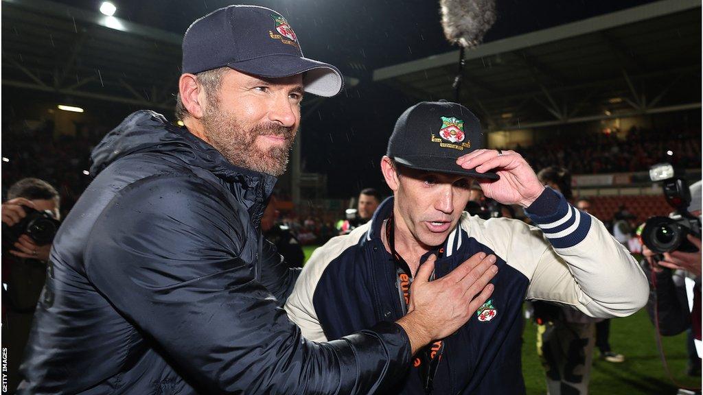 Ryan Reynolds and Rob McElhenney celebrate Wrexham's title win