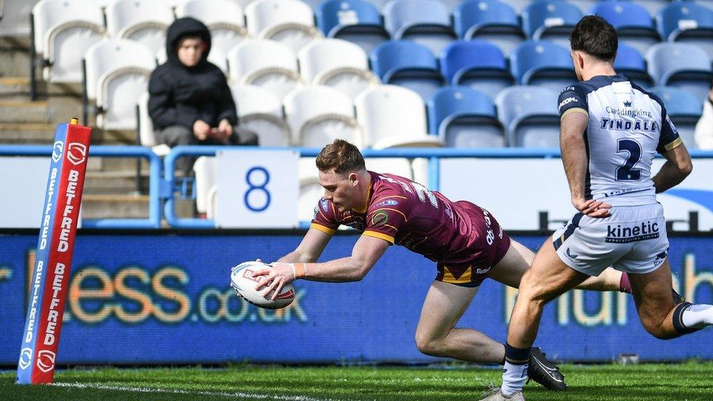 Sam Halsall scored two of Huddersfield's 10 tries. six of which came from the two wings