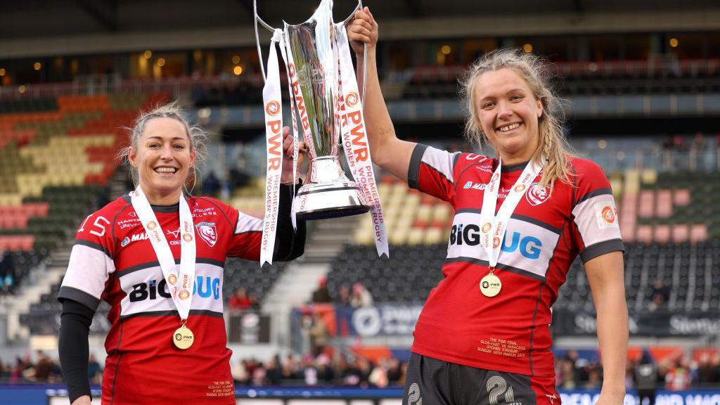 Natasha Hunt and Zoe Aldcroft with the PWR trophy