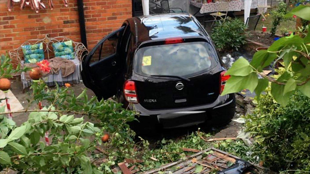 A car crashed through the fence during a garden party.