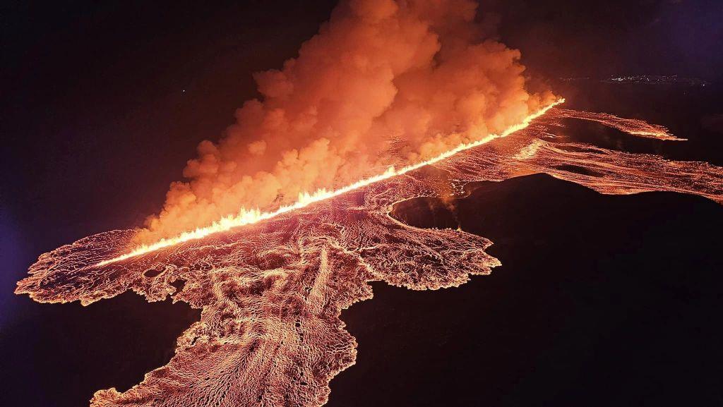 a volcanic crack spews out lava in iceland