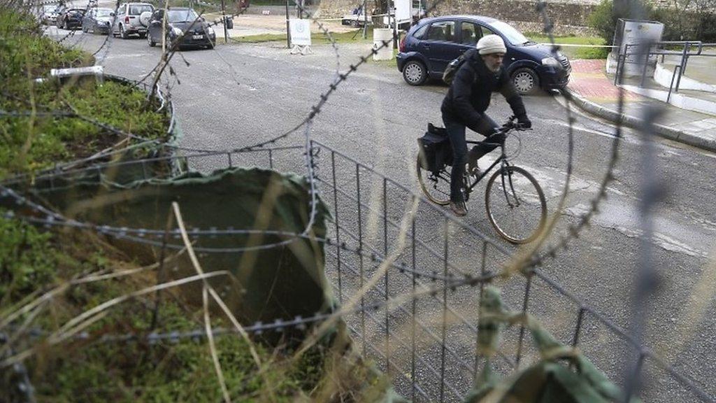 A cyclist crosses the Ledras palace checkpoint in Nicosia, Cyprus