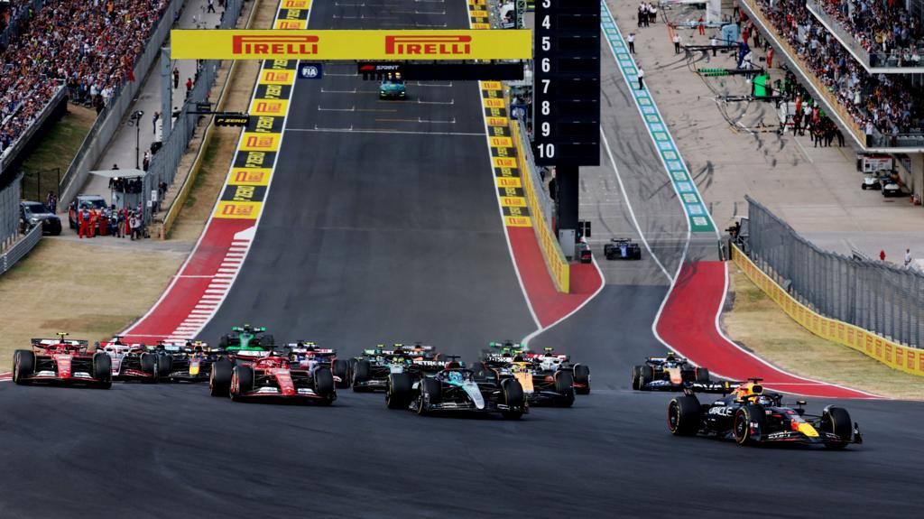 Max Verstappen leads into the first corner of the US Grand Prix sprint race