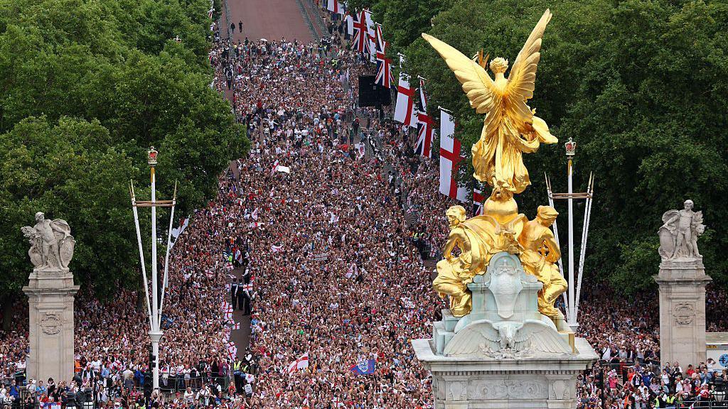Fans cover part of The Mall outside Buckingham Palace