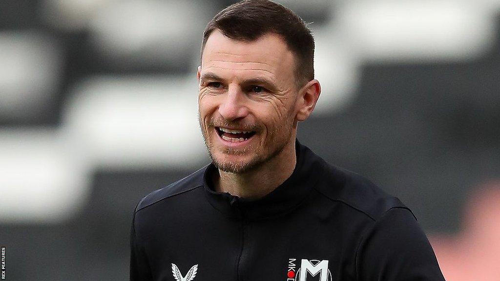 Tommy Smith warming up with MK Dons