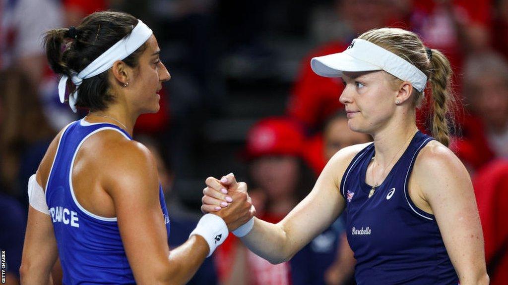 France's Caroline Garcia and Britain's Harriet Dart shake hands after their BJK Cup match