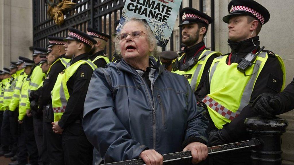 Protestor in front of police