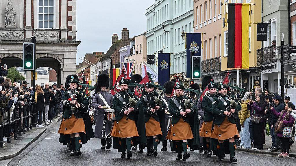 The Pipes No. 12 Company Irish Guards play as part of the Changing of the Guard ceremonies outside Windsor Castle in Windsor, west of London, on November 27, 2025, ahead of the planned visit by Germany's President Frank-Walter Steinmeier in December.