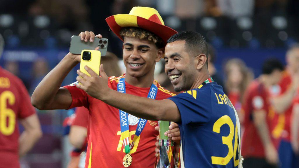 Lamine Yamal of Spain poses with his father Mounir Nasraoui following the UEFA EURO 2024 final match between Spain and England at Olympiastadion on July 14, 2024 in Berlin, Germany