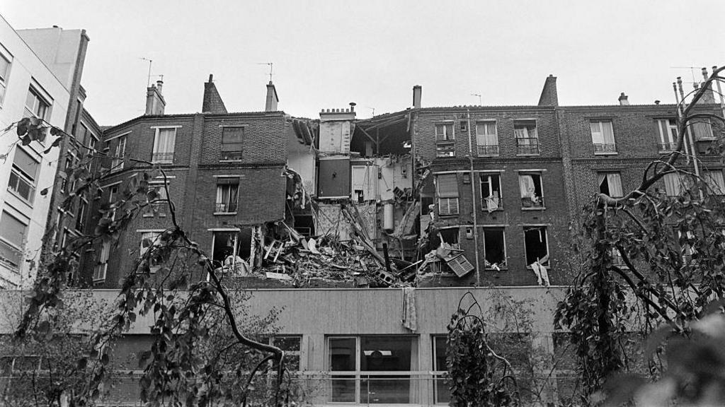 A black and white photo of the Le Pen's flat which was destroyed in a blast in 1976