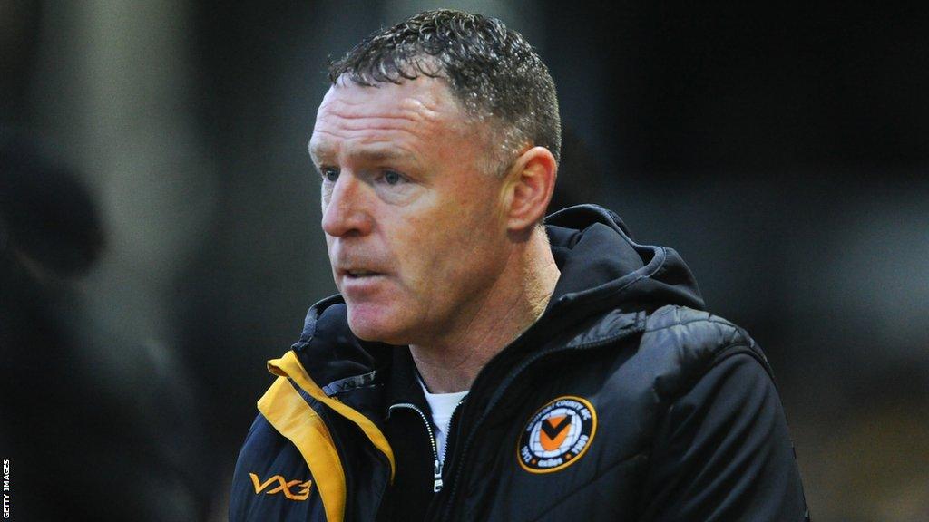 Newport County boss Graham Coughlan looks on