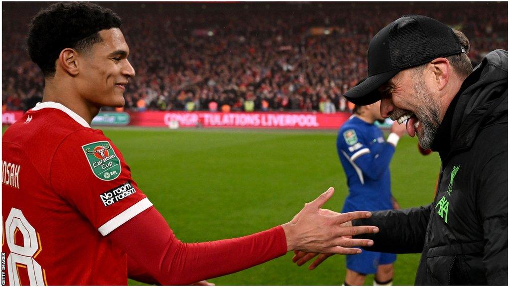 Jarell Quansah celebrates with Jurgen Klopp after Carabao Cup win