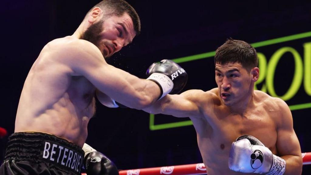 Artur Beterbiev is punched by Dmitry Bivol