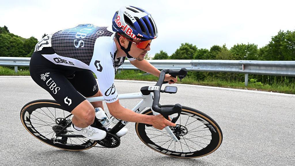 Tom Pidcock takes a corner on his bike
