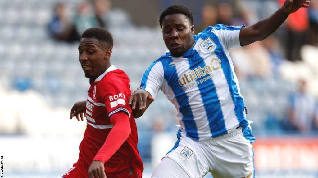 Huddersfield Town defender Jaheim Headley (right)