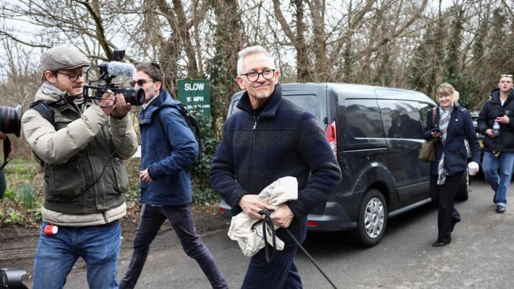 Gary Lineker walking with his dog