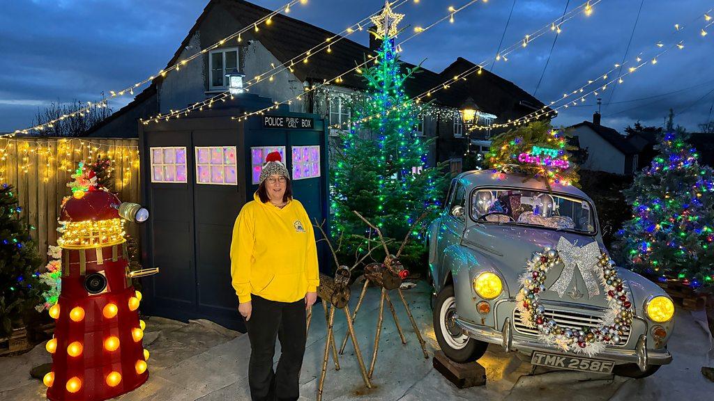 Jenni Wood stood next to her Doctor Who display