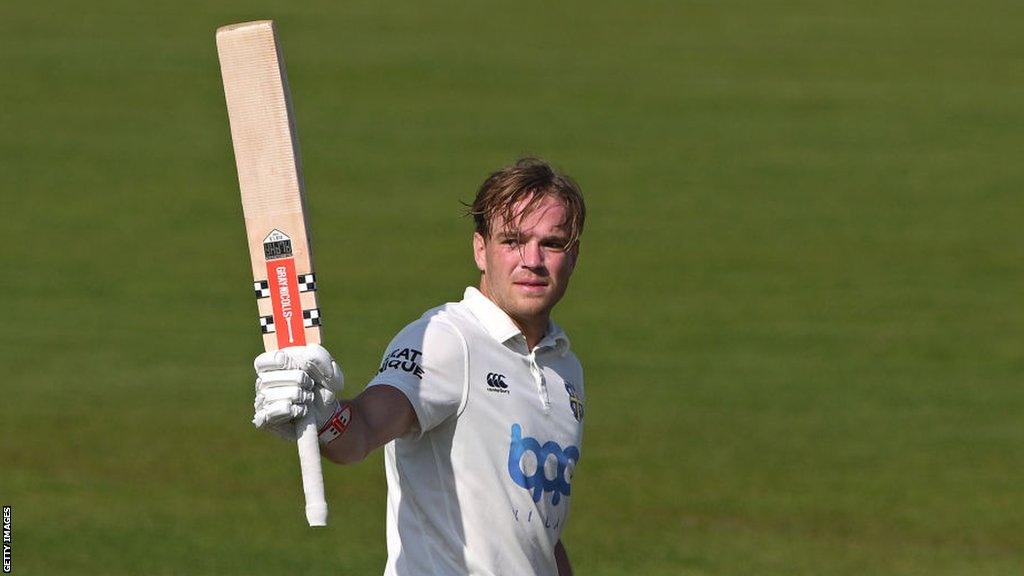 Bas de Leede raises his bat after making his maiden first-class century for Durham against Sussex