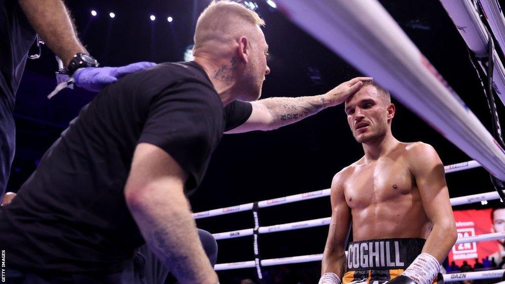 Trainer Stefy Bull comforts Connor Coghill after a loss to Hopey Price in October