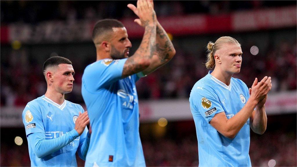 Manchester City players Phil Foden, Kyle Walker and Erling Haaland